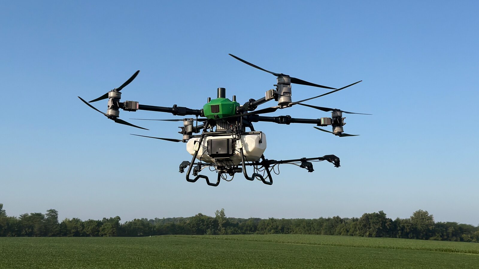 R-40 Revolution Drone in flight over a green field